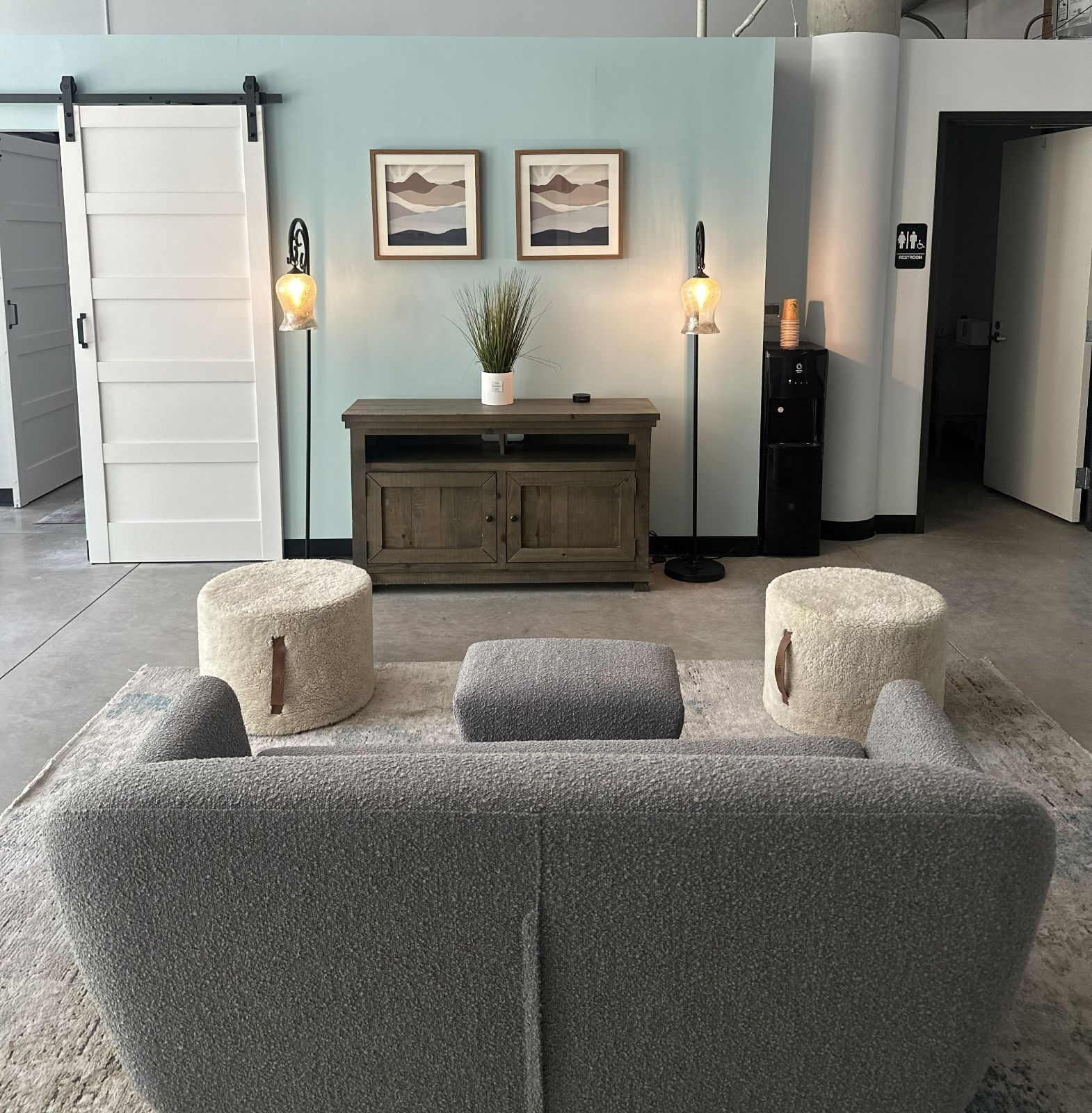 Amplify Wellness lounge with seating and a tea station