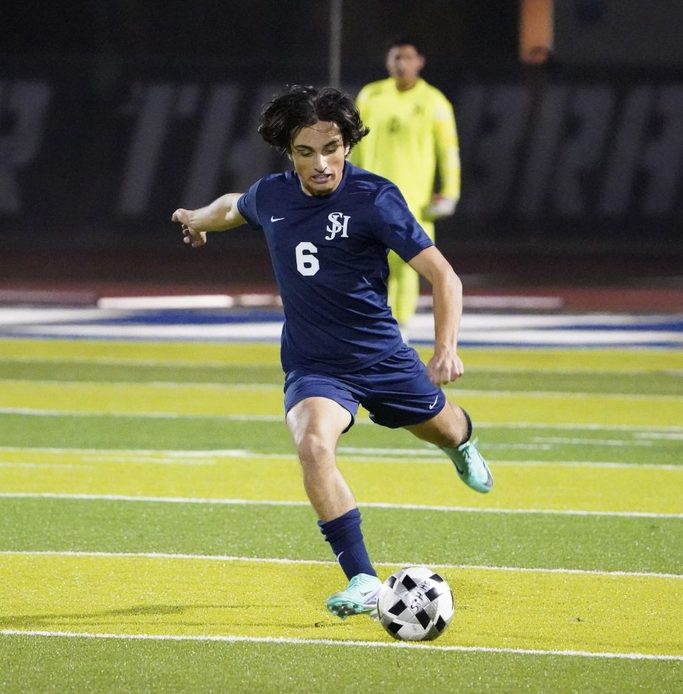 Aydin Khan playing soccer